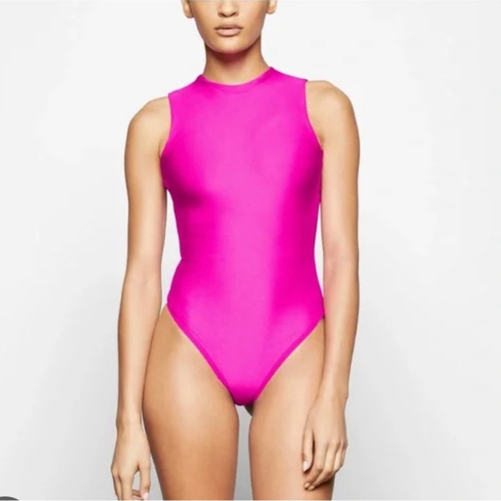 Skims Disco Sleeveless Thong Body Suit in hot pink